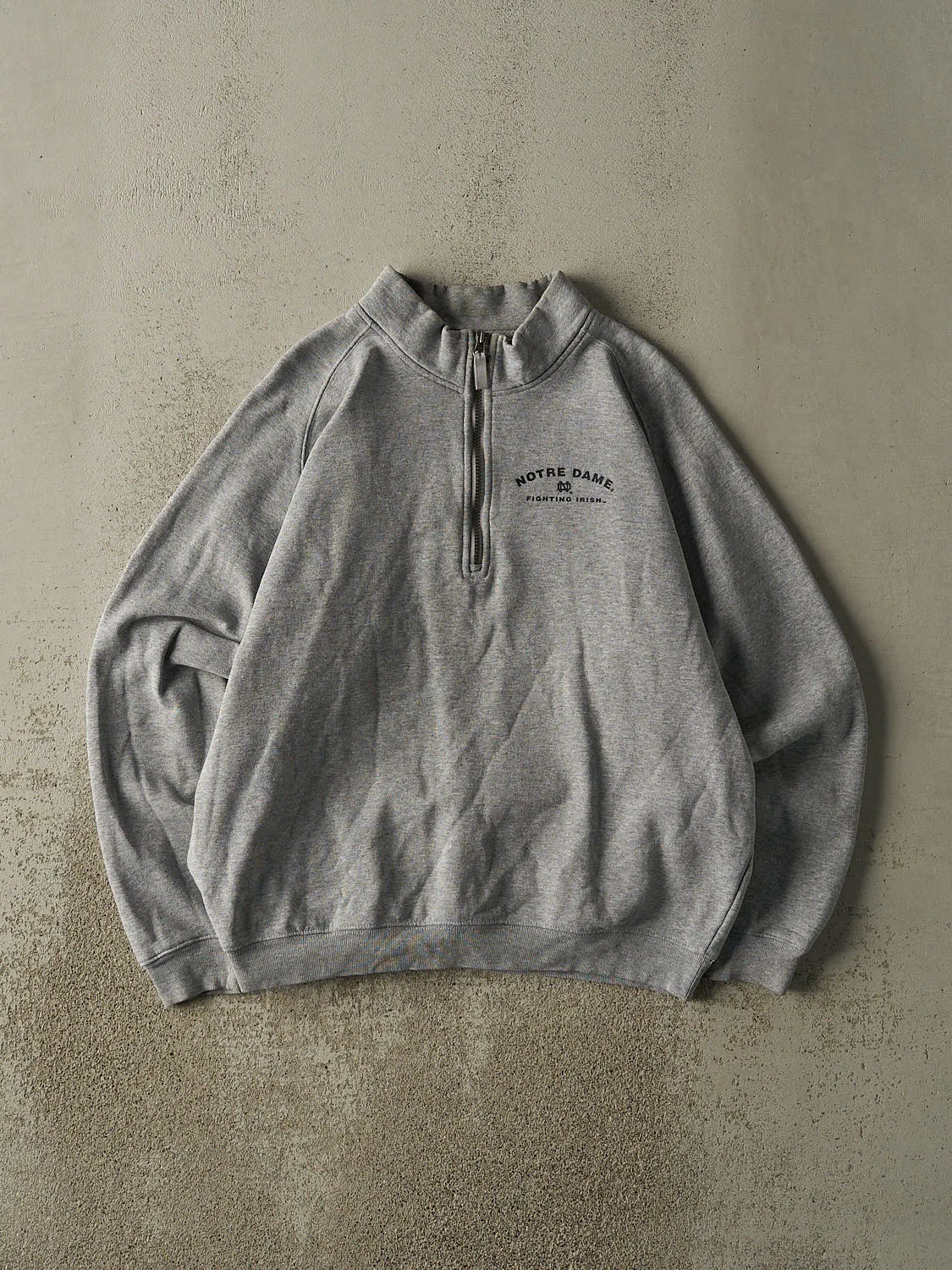 Vintage 90s Grey University of Notre Dame Fighting Irish Quarter Zip Sweater (L) sold by Rebalance Vintage