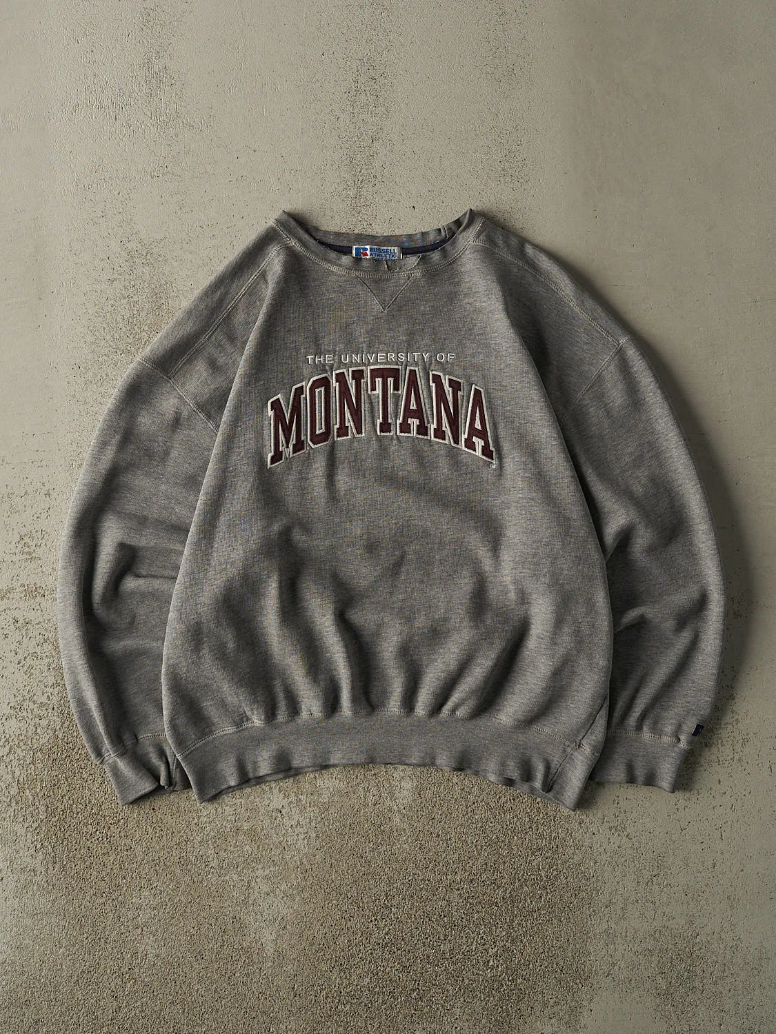 Vintage 90s Grey University of Montana Embroidered Russell Athletic Crewneck (L/XL) sold by Rebalance Vintage