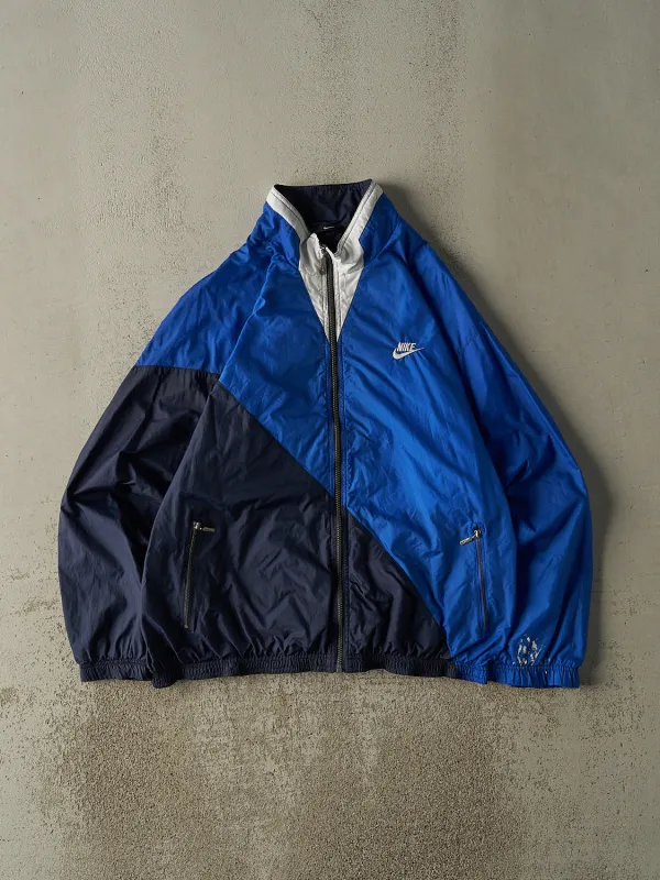 Vintage 90s Blue & White Nike Windbreaker (L/XL) sold by Rebalance Vintage