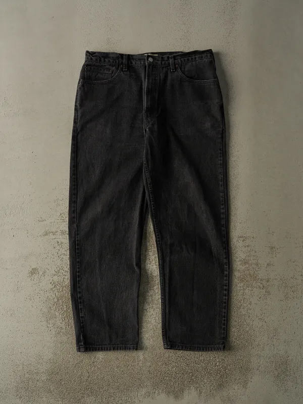 Vintage 90s Faded Black Levi's 550 Relaxed Fit Tapered Leg Denim Pants (36x31) sold by Rebalance Vintage