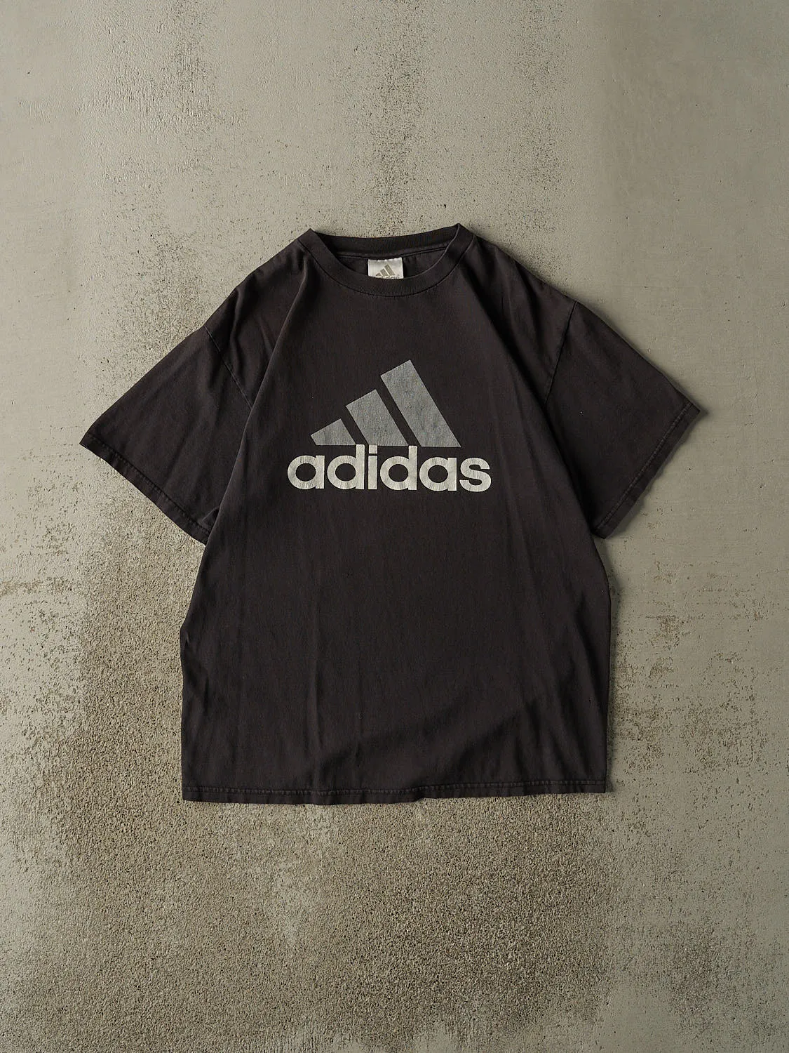 Vintage 90s Faded Black Adidas Logo Tee (M/L) sold by Rebalance Vintage