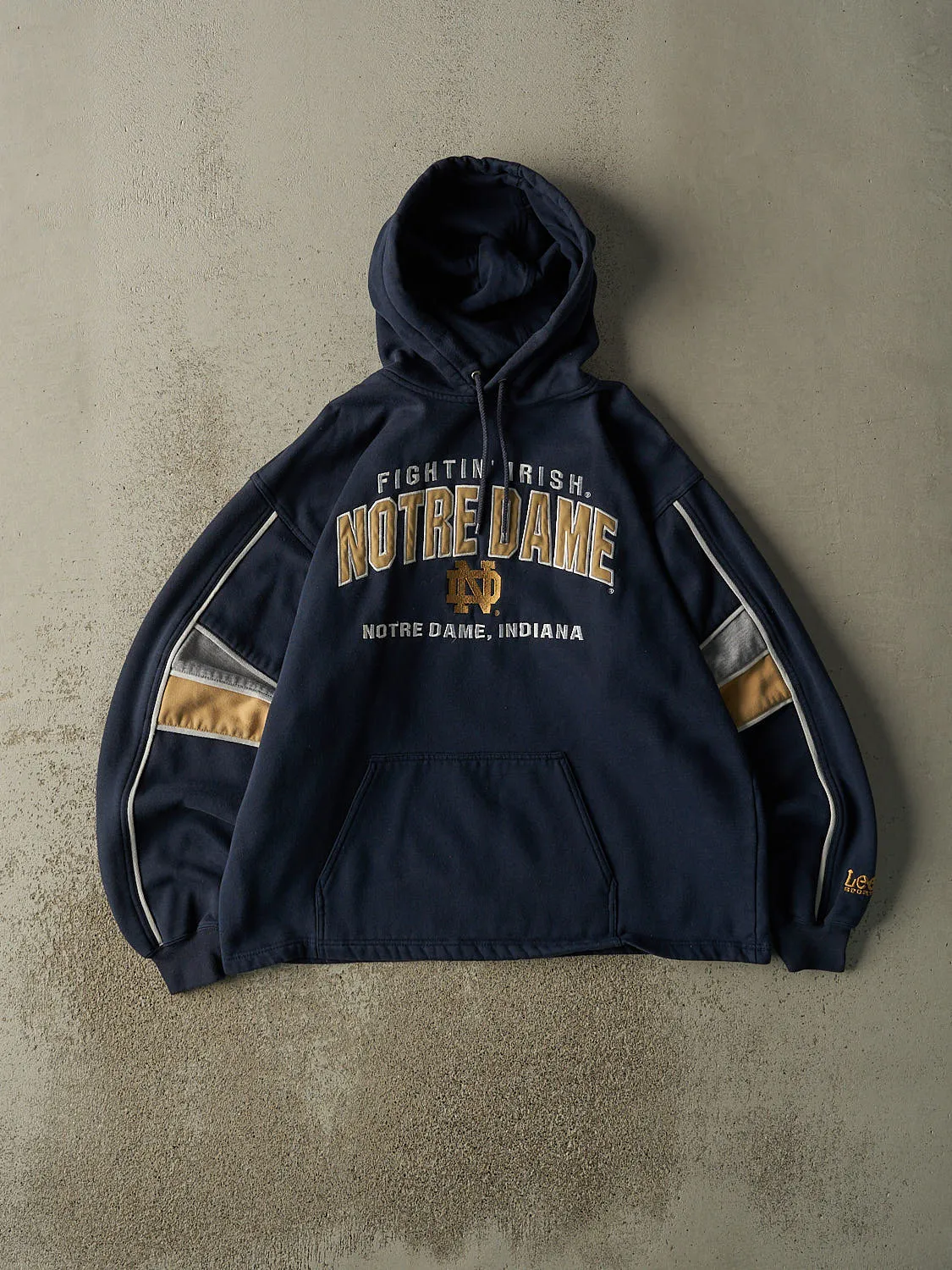 Vintage 90s Navy Blue Notre Dame Fighting Irish Embroidered Hoodie (L/XL) sold by Rebalance Vintage
