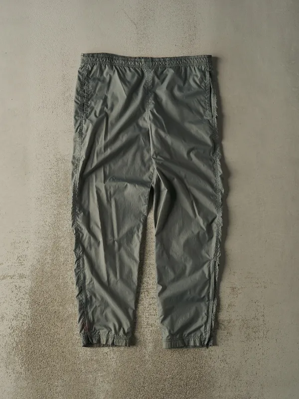 Vintage 90s Washed Green Nike Embroidered Track Pants (36x31) sold by Rebalance Vintage