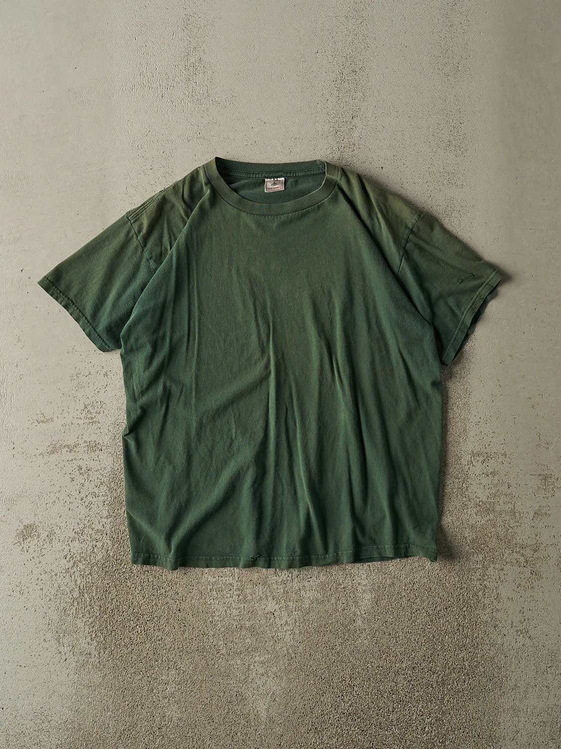 Vintage 90s Sun Faded Green Blank Tee (M/L) sold by Rebalance Vintage