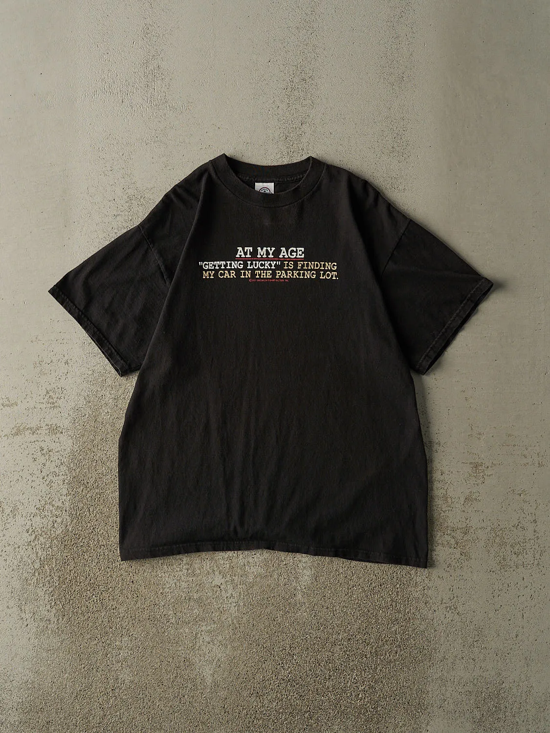 Vintage Y2K Black "Getting Lucky" Slogan Tee (L) sold by Rebalance Vintage