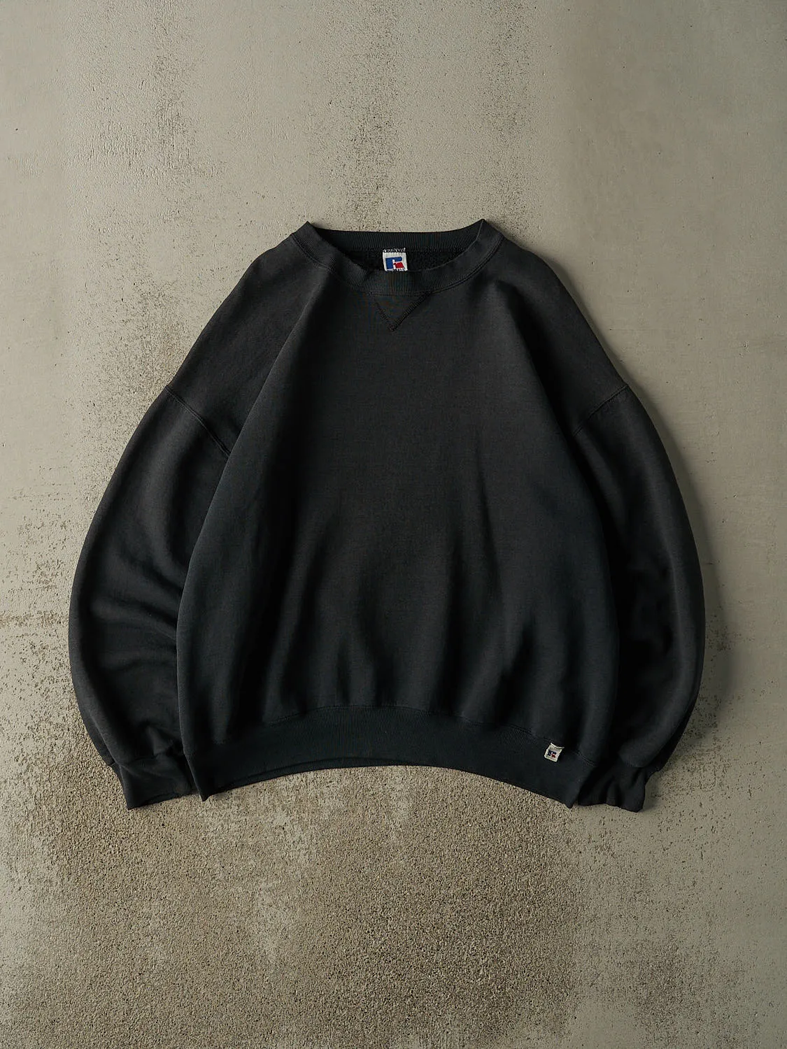 Vintage 90s Faded Black Russell Athletic Blank Crewneck (XL/XXL) sold by Rebalance Vintage