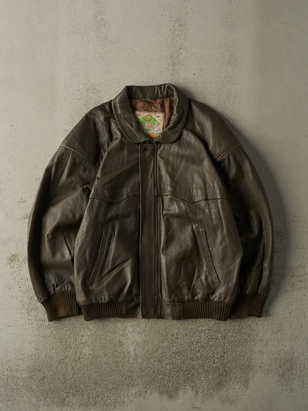 Vintage 90s Brown Leather Bomber Jacket (XL) sold by Rebalance Vintage