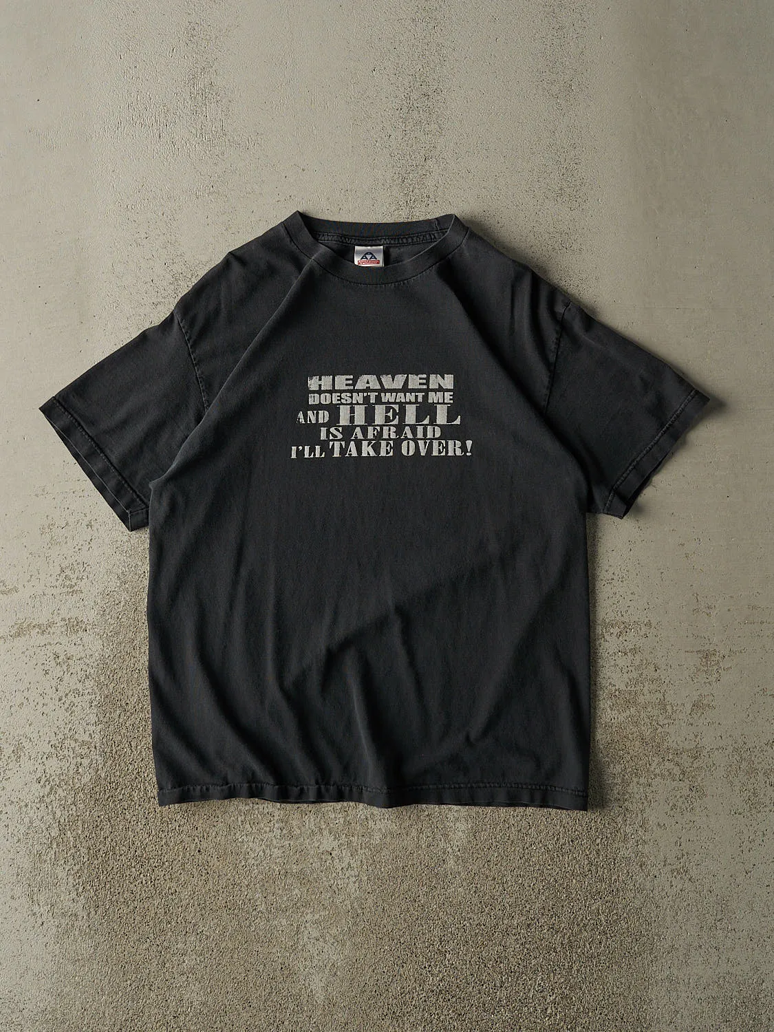 Vintage Y2K Faded Black "Heaven Doesn't Want Me" Slogan Tee (L) sold by Rebalance Vintage