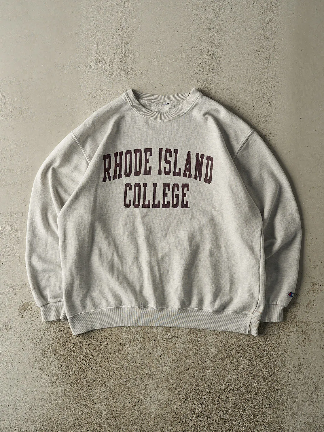 Vintage 90s Heather Grey Rhode Island College Crewneck (L/XL) sold by Rebalance Vintage