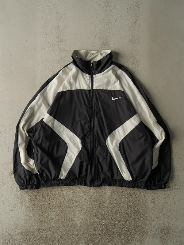 Vintage 90s Black & White Nike Embroidered Windbreaker Jacket (XL/XXL) sold by Rebalance Vintage