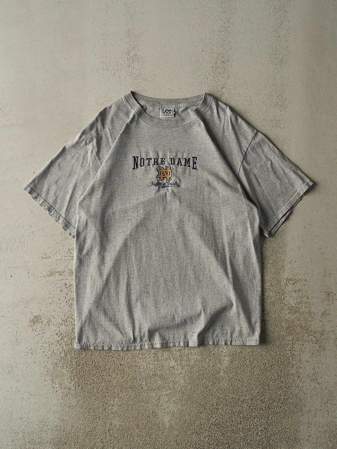 Vintage 90s Grey Notre Dame Embroidered Tee (L/XL) sold by Rebalance Vintage