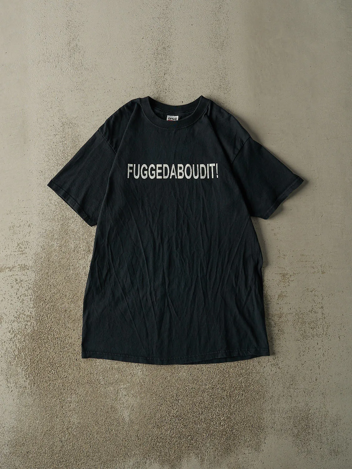 Vintage Y2K Black "Fuggedaboudit!" Slogan Tee (M) sold by Rebalance Vintage