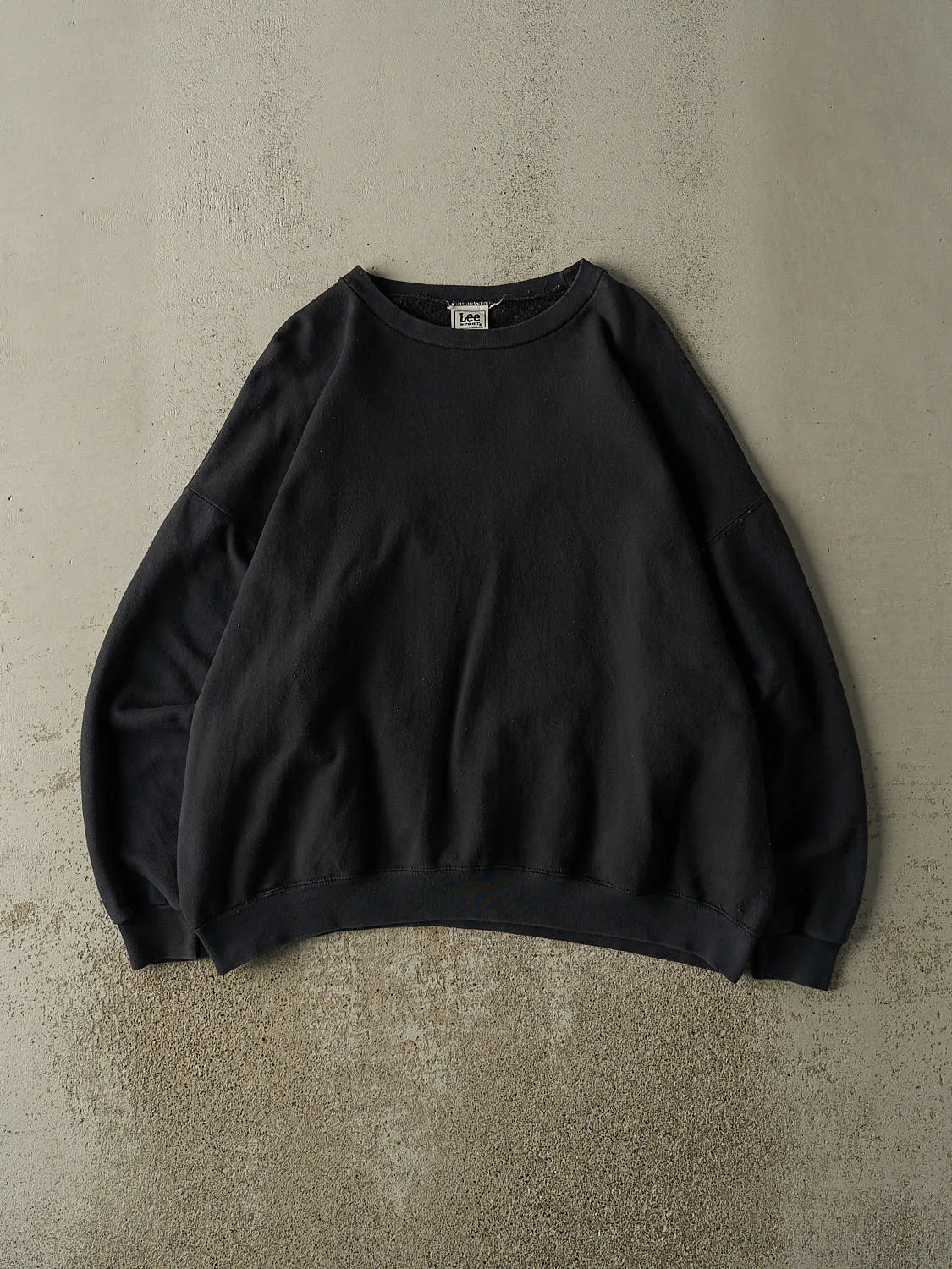 Vintage 90s Faded Black Blank Crewneck (XL) sold by Rebalance Vintage
