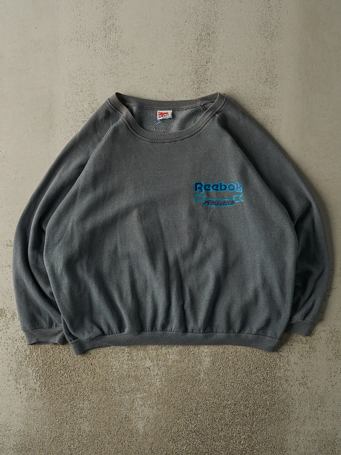 Vintage 80s Charcoal Grey Reebok Crewneck (L/XL) sold by Rebalance Vintage