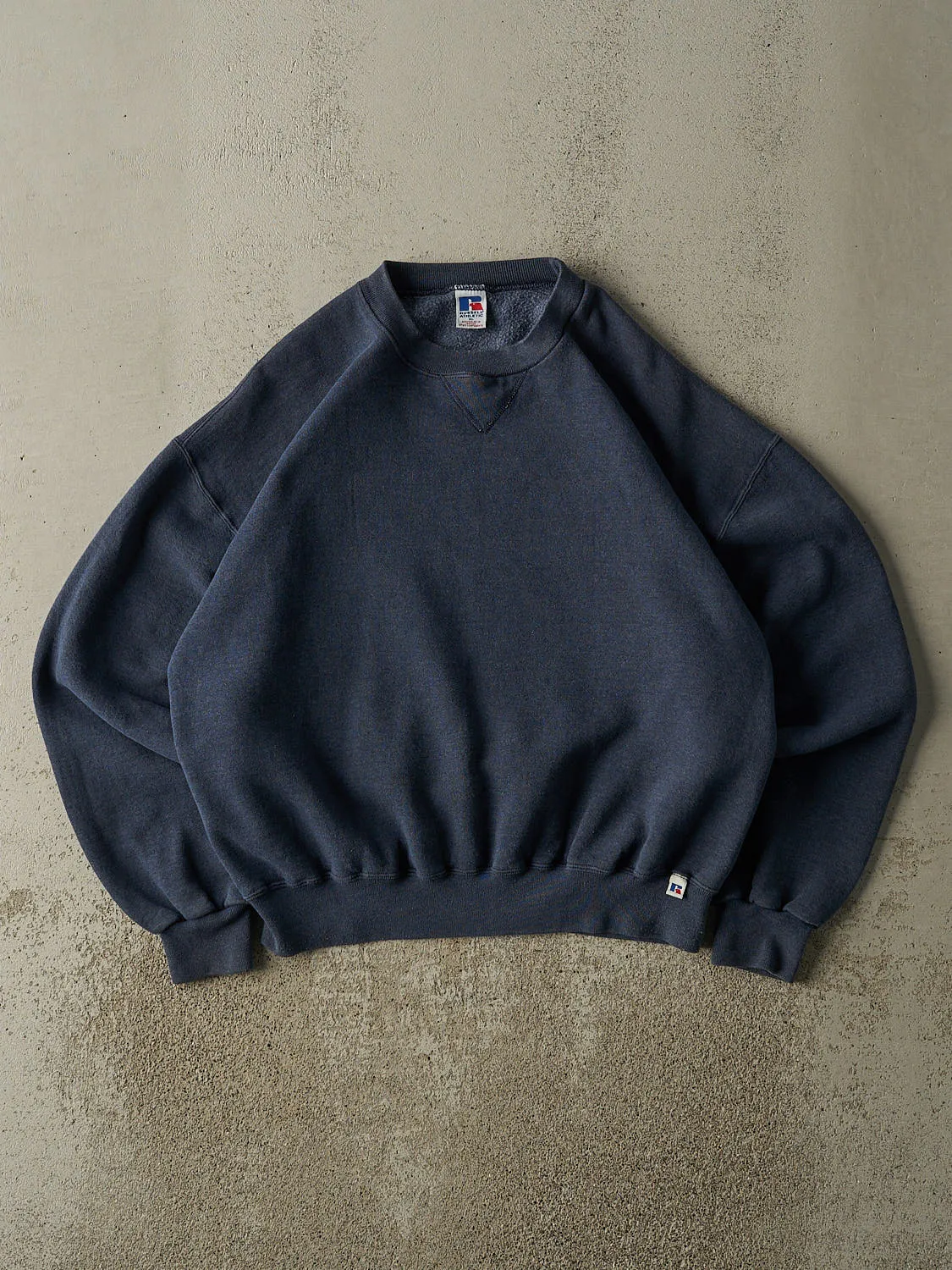 Vintage 90s Sun Faded Navy Russell Athletic Blank Crewneck (L/XL) sold by Rebalance Vintage