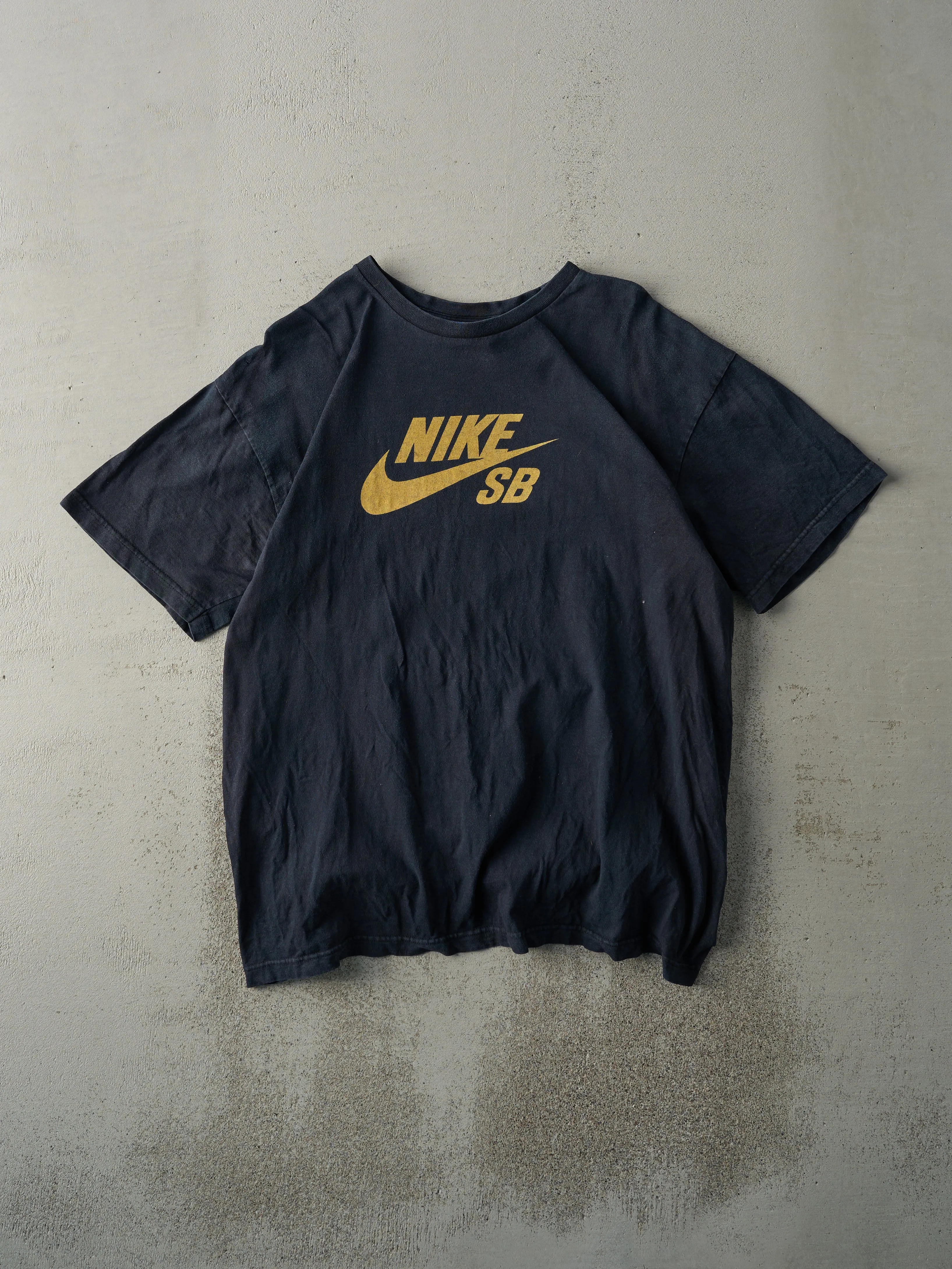 Vintage Y2K Faded Black Nike SB Logo Tee (M/L) sold by Rebalance Vintage