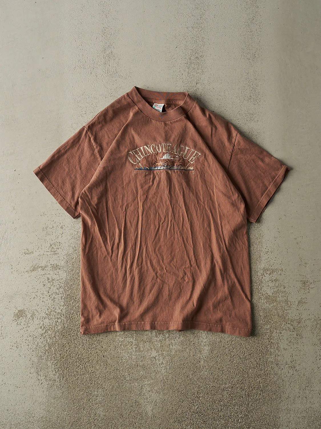 Vintage 90s Sun Faded Brown Chincoteague Island Embroidered Tee (M/L) sold by Rebalance Vintage