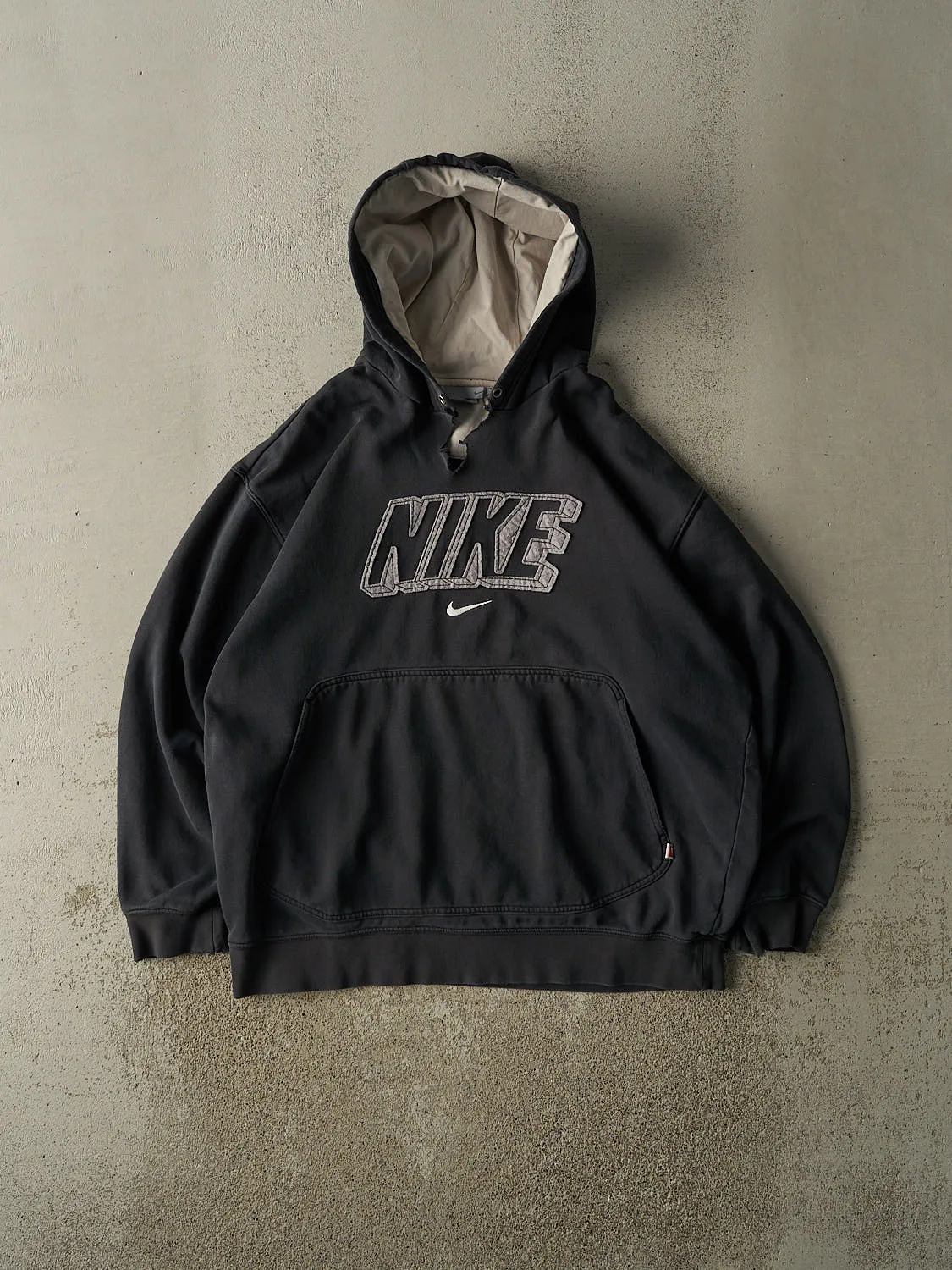 Vintage 90s Faded Black Nike Embroidered Hoodie (XL) sold by Rebalance Vintage