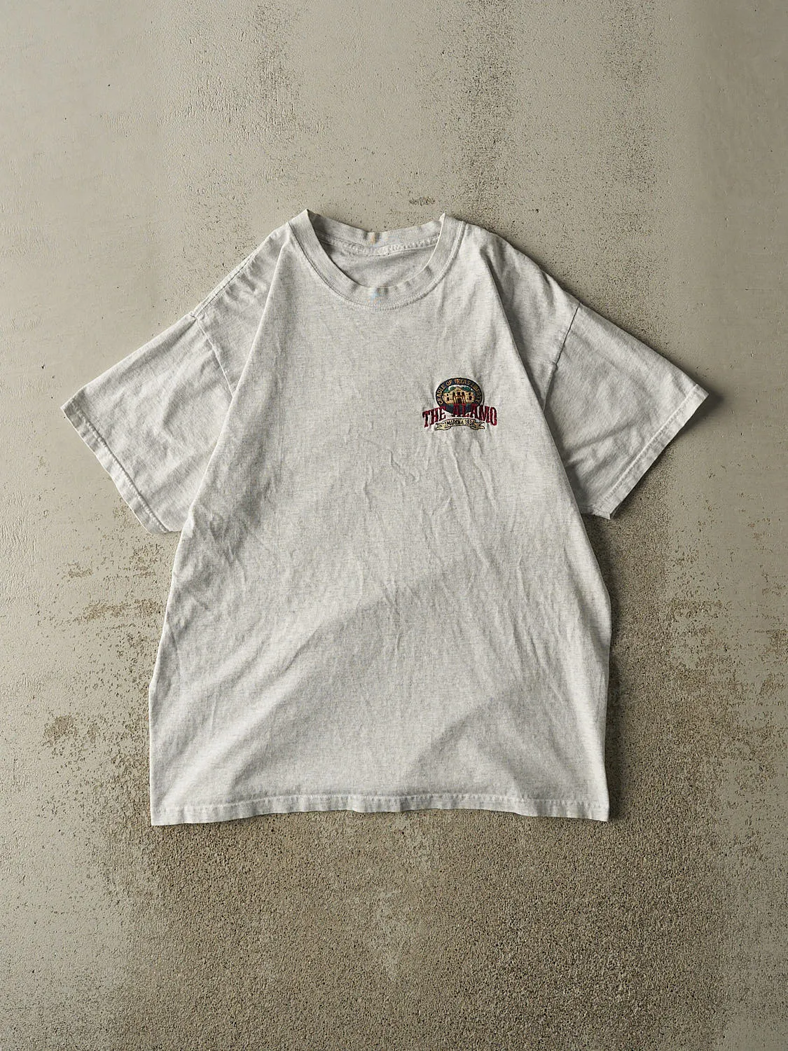 Vintage 90s Heather Grey The Alamo Embroidered Tee (M/L) sold by Rebalance Vintage