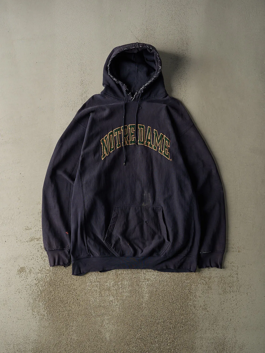Vintage 90s Sun Faded Navy University of Notre Dame Embroidered Hoodie (XXL) sold by Rebalance Vintage