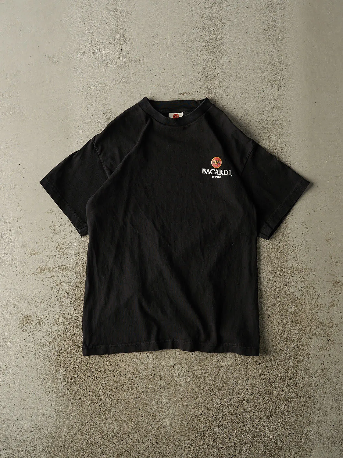 Vintage 90s Black Bacardi Tee (S/M) sold by Rebalance Vintage