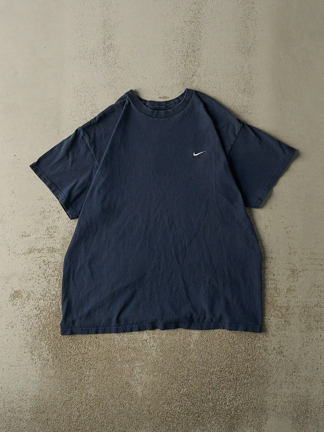Vintage 90s Navy Blue Nike Embroidered Tee (XL) sold by Rebalance Vintage