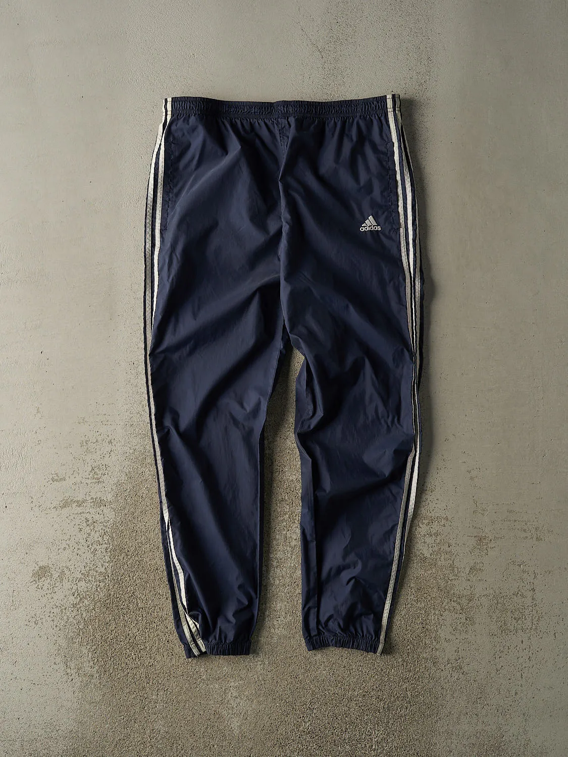 Vintage 90s Navy Blue Adidas Striped Track Pants (36x31) sold by Rebalance Vintage