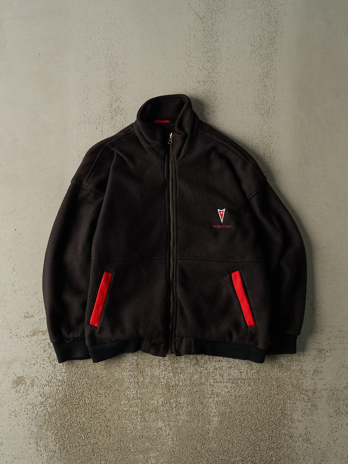 Vintage 90s Black Pontiac Embroidered Fleece Jacket (M/L) sold by Rebalance Vintage