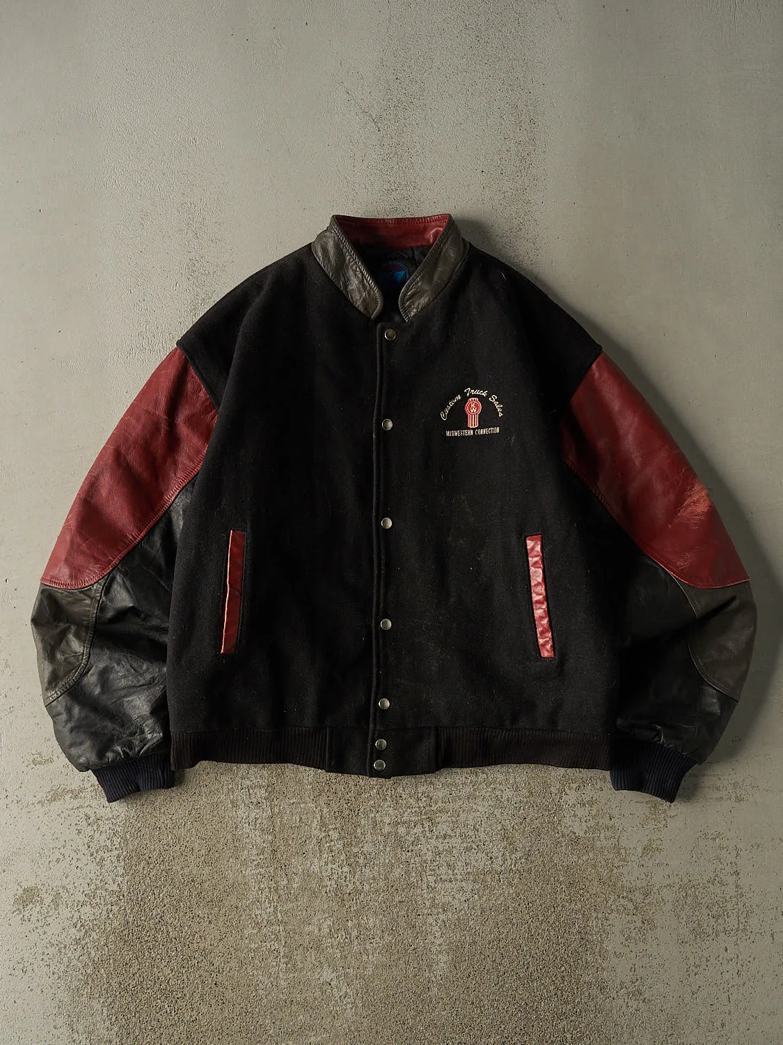 Vintage 90s Black Kenworth Embroidered Varsity Jacket (XL) sold by Rebalance Vintage
