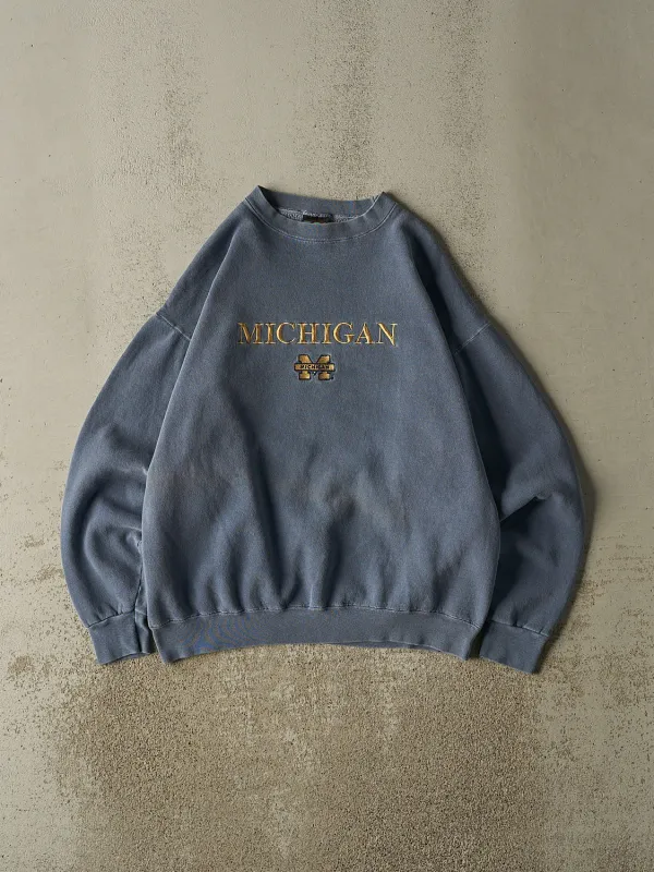 Vintage 80s Washed Blue University of Michigan Crewneck (L) sold by Rebalance Vintage