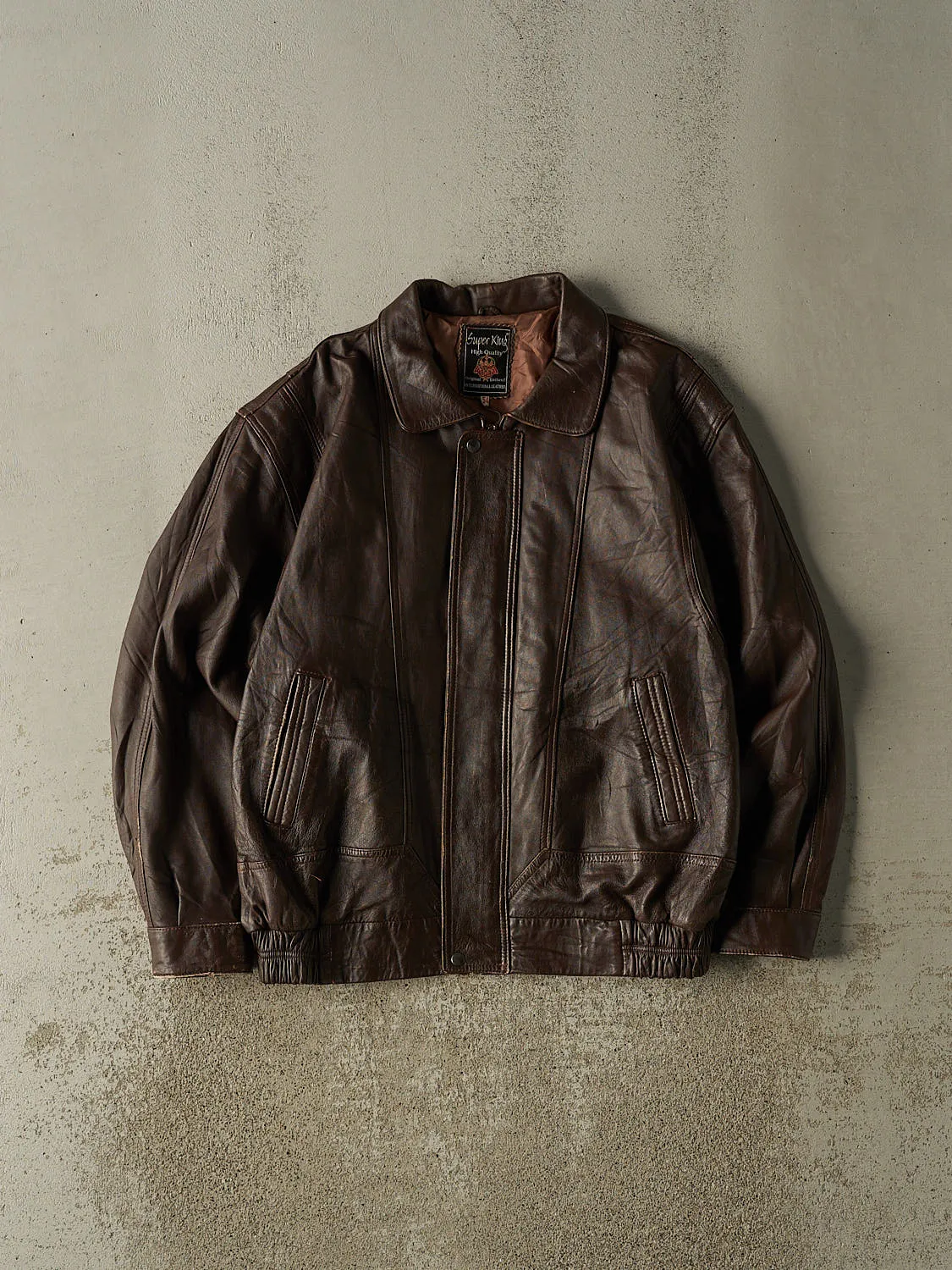 Vintage 80s Brown Leather Bomber Jacket (L/XL) sold by Rebalance Vintage