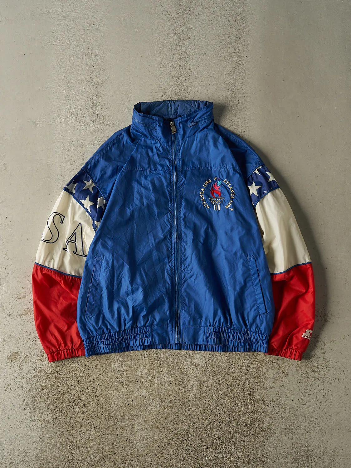 Vintage 96' Blue Atlanta Olympics Team USA Starter Windbreaker Jacket (XL) sold by Rebalance Vintage