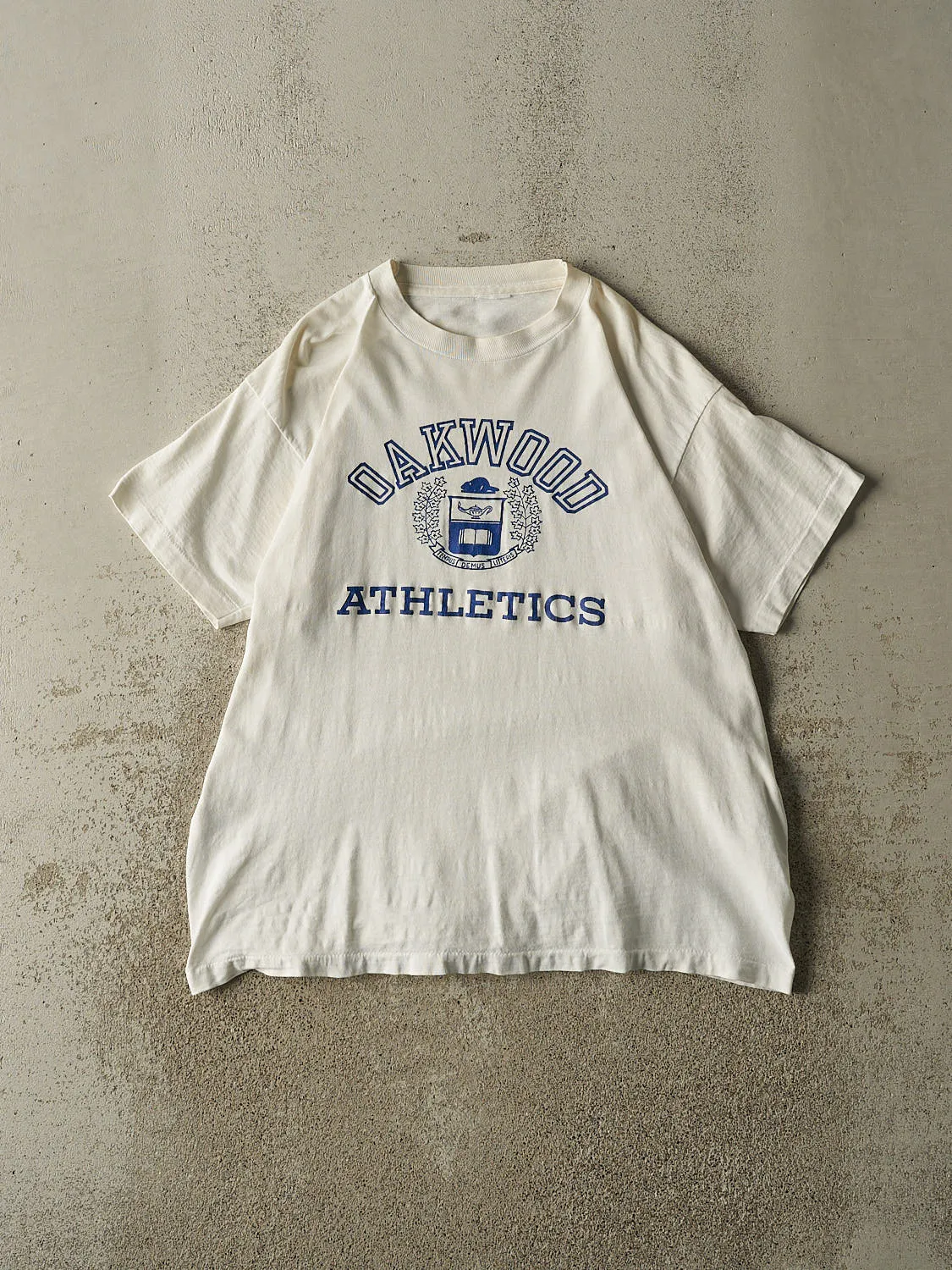 Vintage 90s White Oakwood Athletics Single Stitch Tee (L/XL) sold by Rebalance Vintage