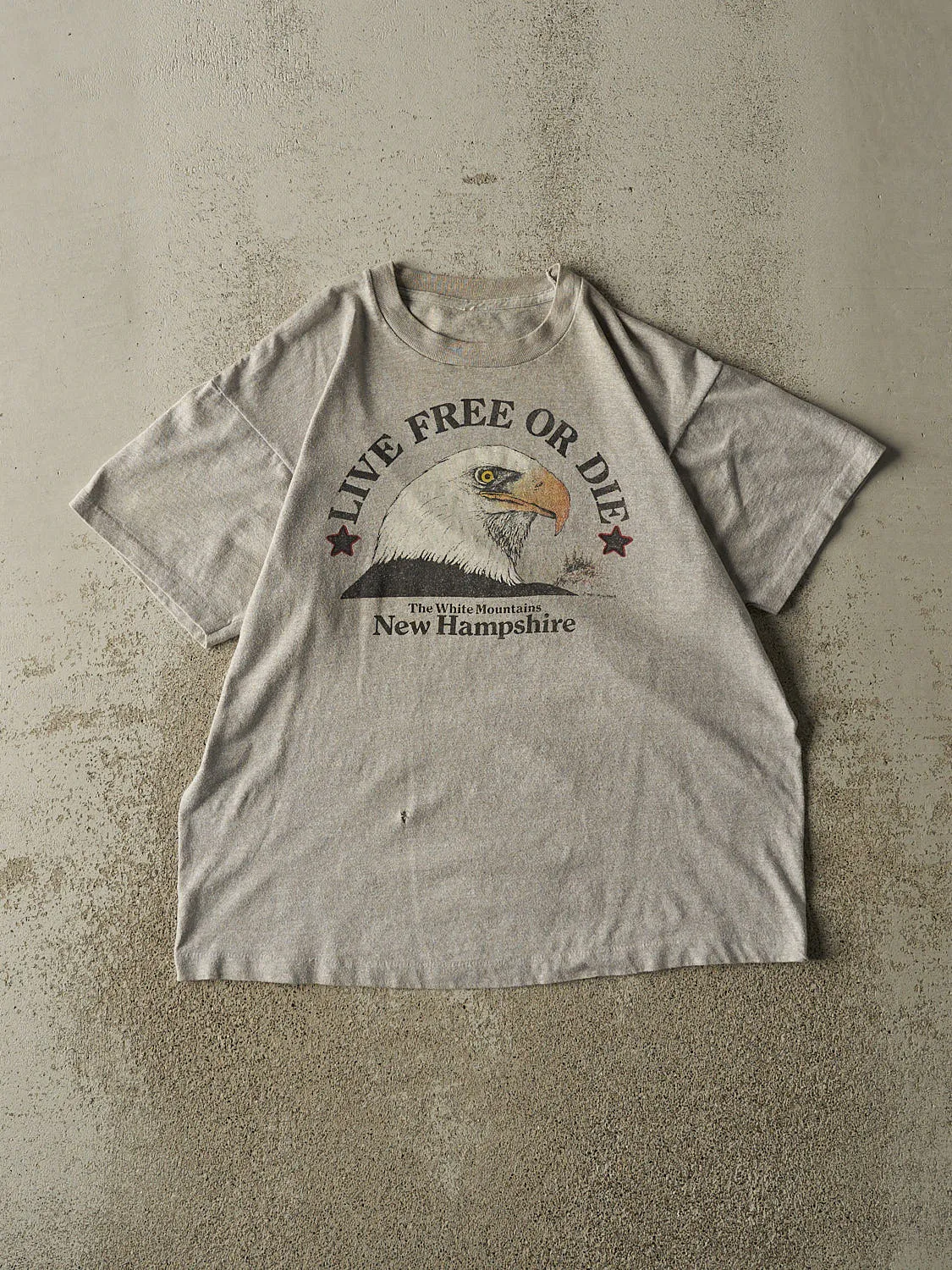 Vintage 90s Grey New Hampshire Tee (M) sold by Rebalance Vintage