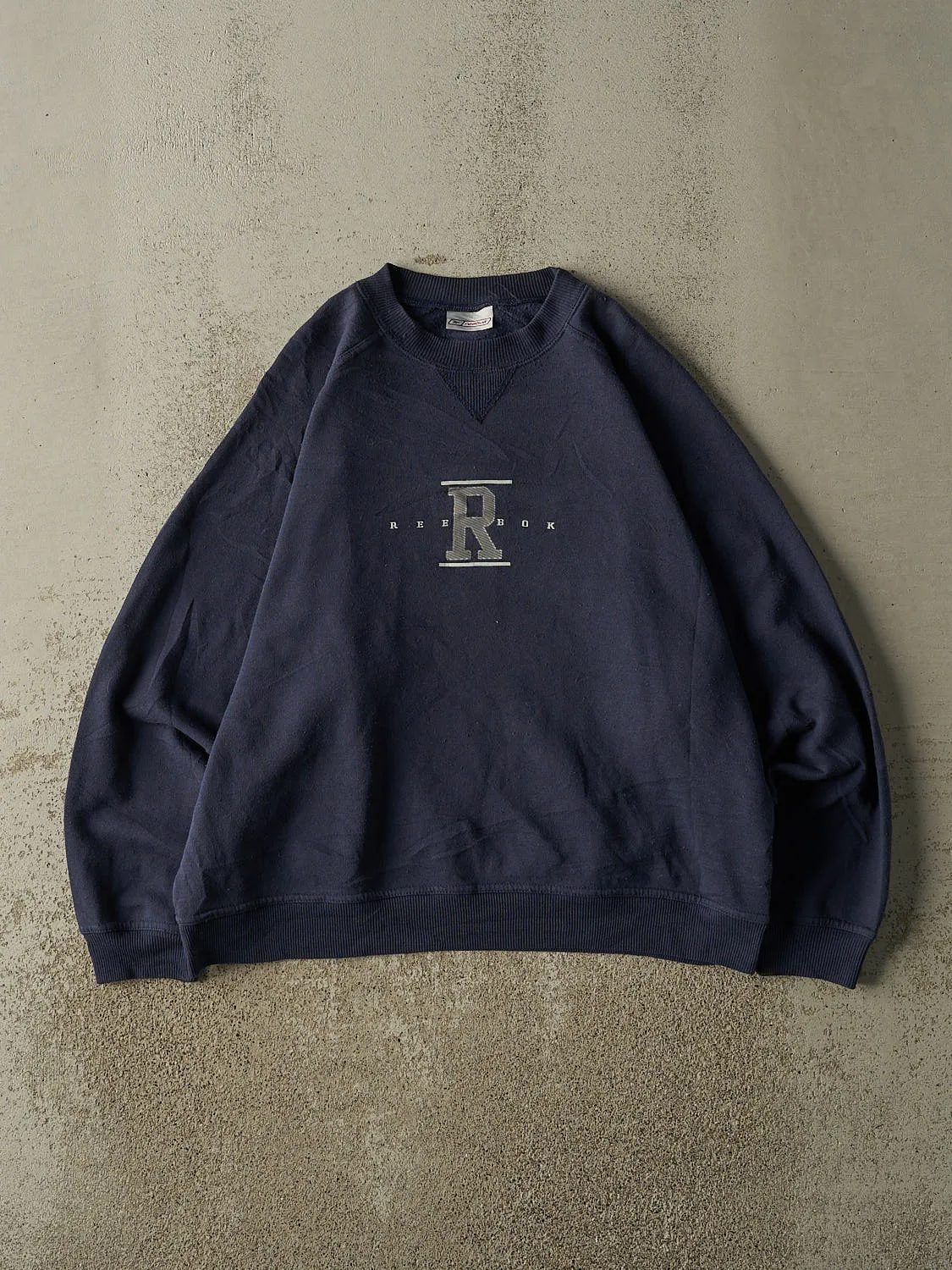 Vintage 90s Navy Blue Reebok Crewneck (M) sold by Rebalance Vintage