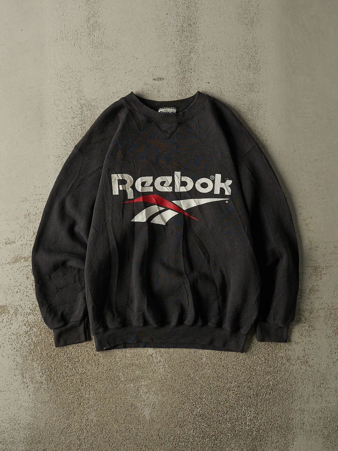 Vintage 90s Faded Black Reebok Crewneck (S/M) sold by Rebalance Vintage