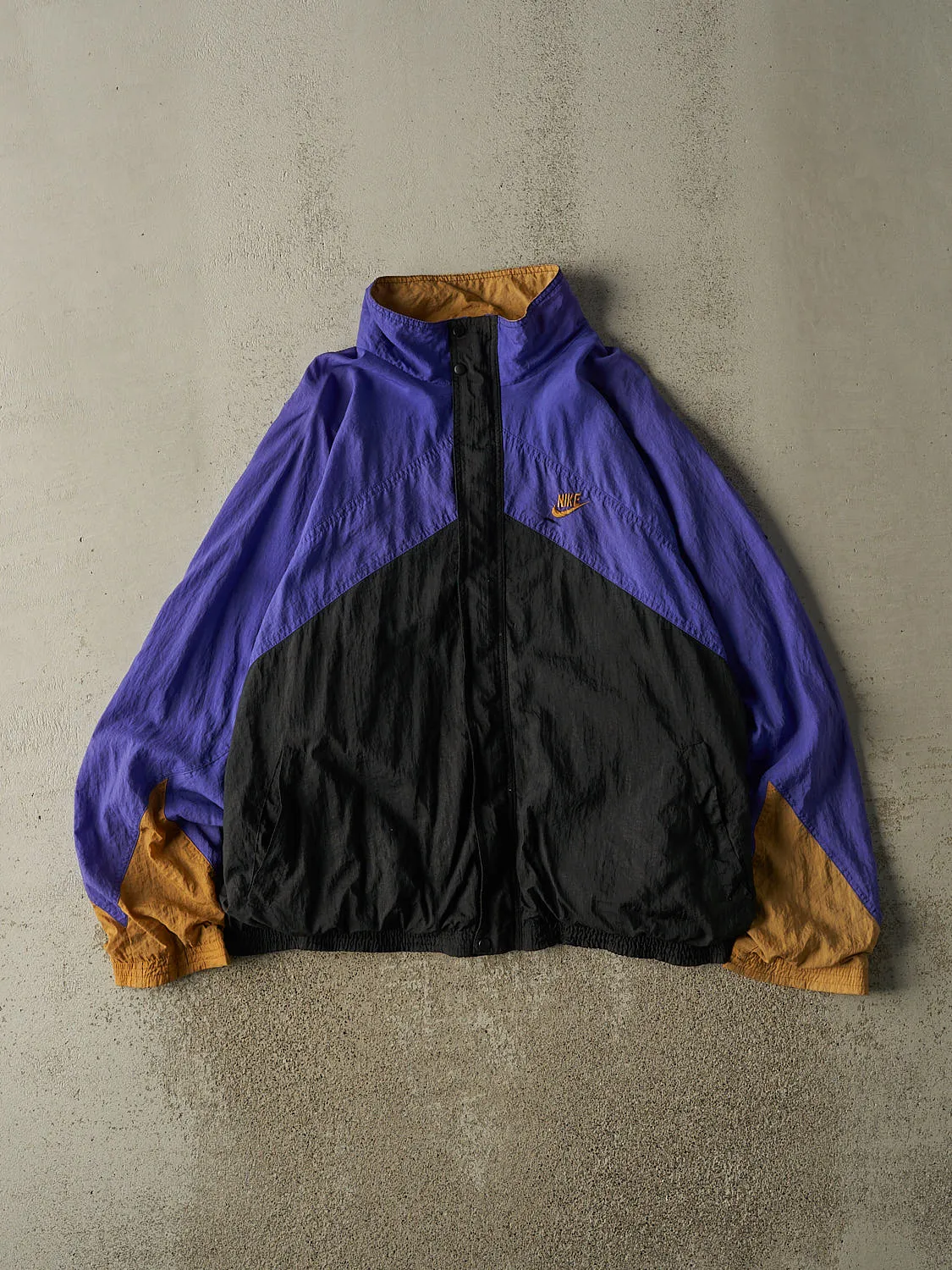 Vintage 90s Purple, Black & Gold Nike Windbreaker Jacket (XL) sold by Rebalance Vintage