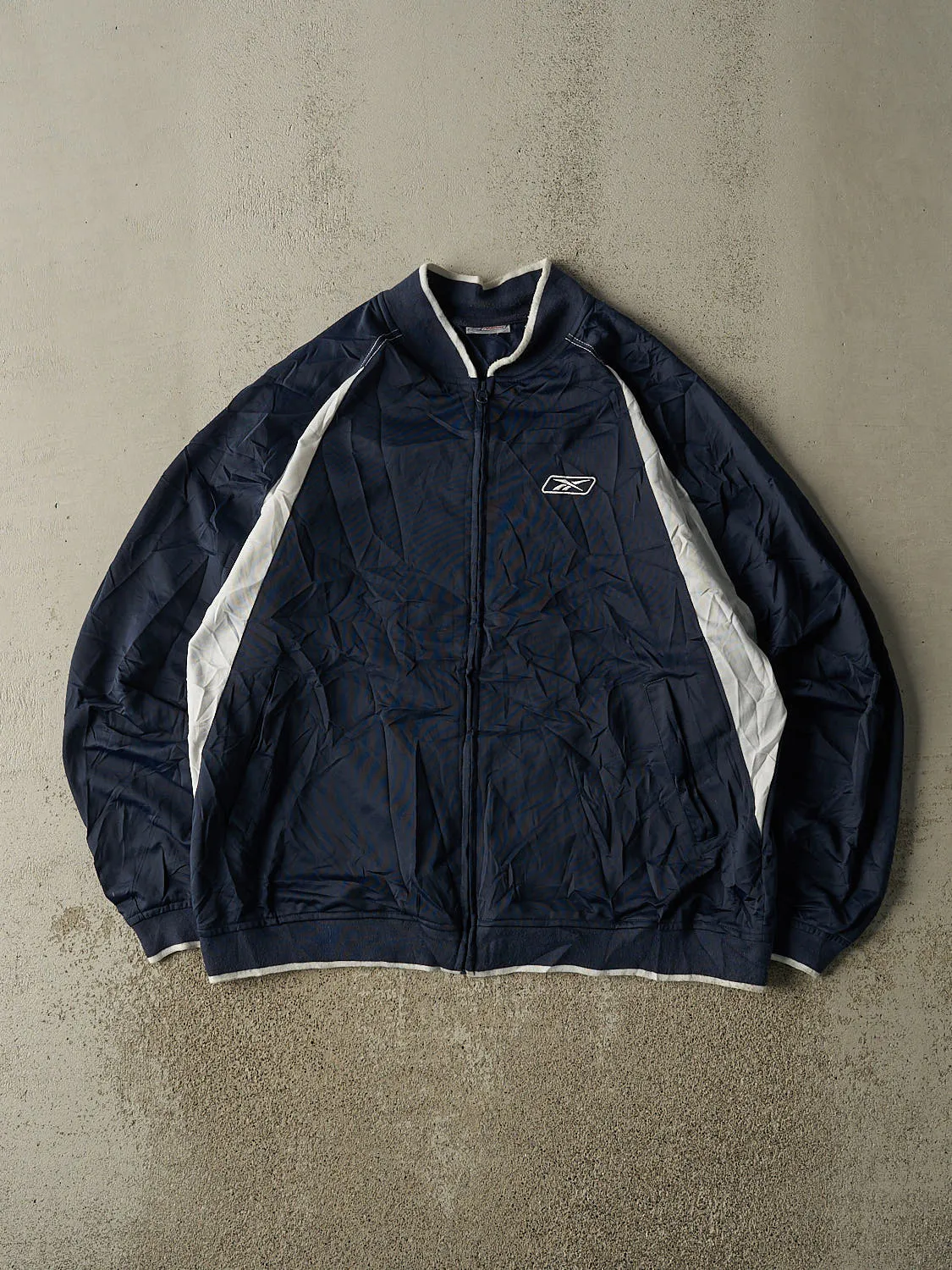 Vintage 90s Navy Blue Reebok Zip Up Lightweight Track Jacket (XL/XXL) sold by Rebalance Vintage