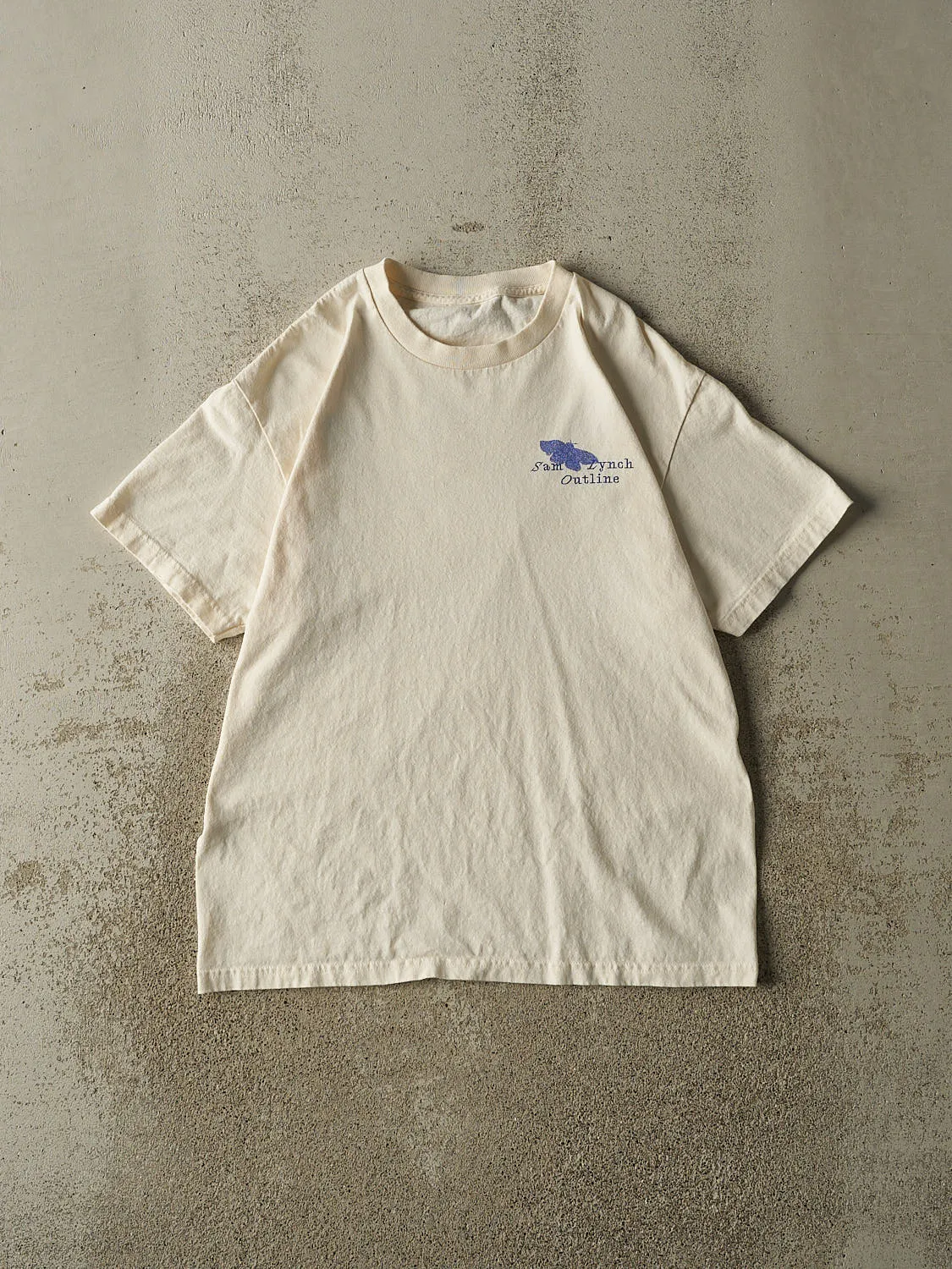 Vintage 90s Beige Sam Lynch Outline Tee (L) sold by Rebalance Vintage