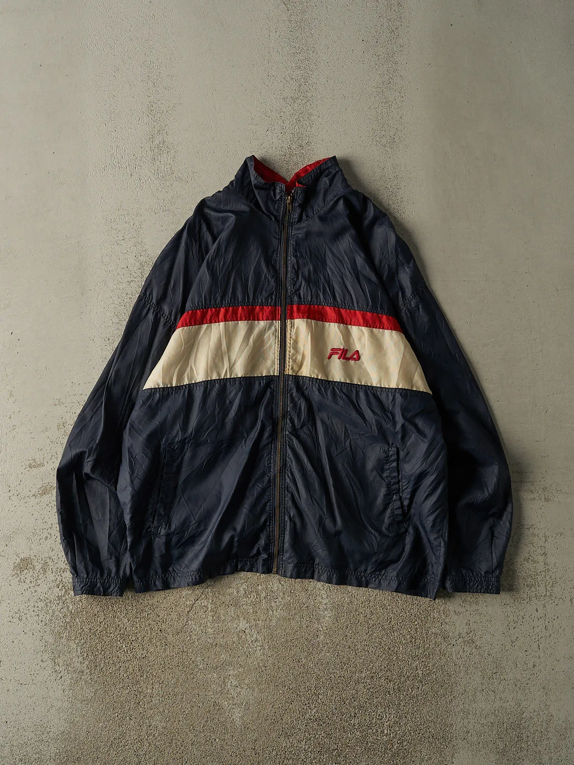 Vintage 90s Navy Blue Fila Windbreaker Jacket (XL/XXL) sold by Rebalance Vintage