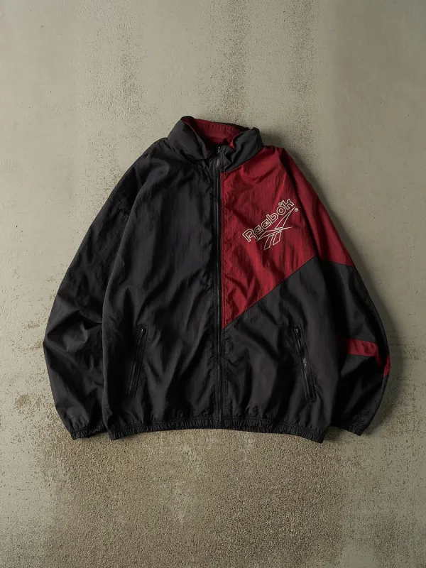 Vintage 90s Burgundy & Black Reebok Embroidered Windbreaker Jacket (L/XL) sold by Rebalance Vintage