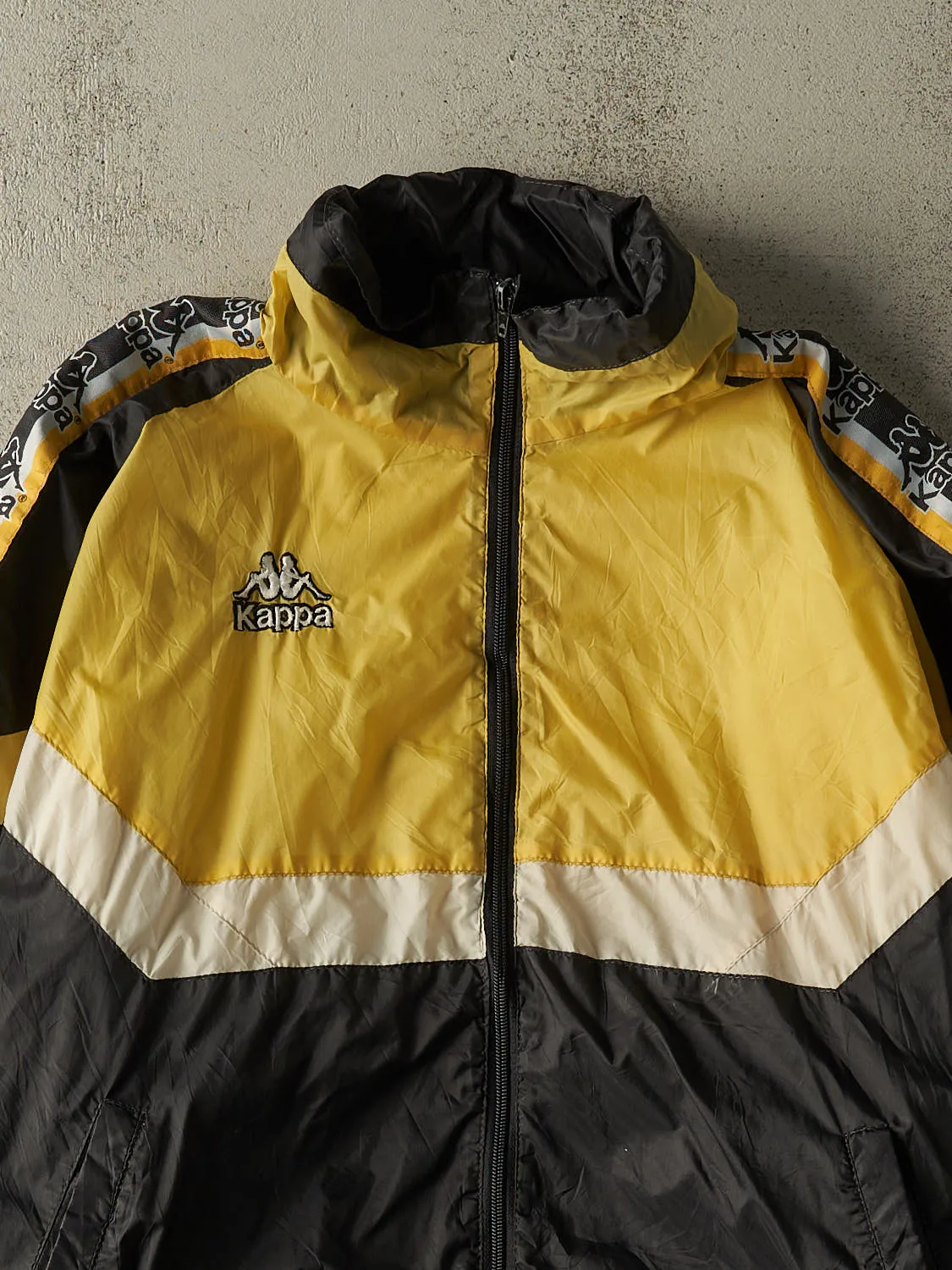 Vintage 90s Black & Yellow Kappa Windbreaker Jacket (L/XL) sold by Rebalance Vintage product image thumbnail 2