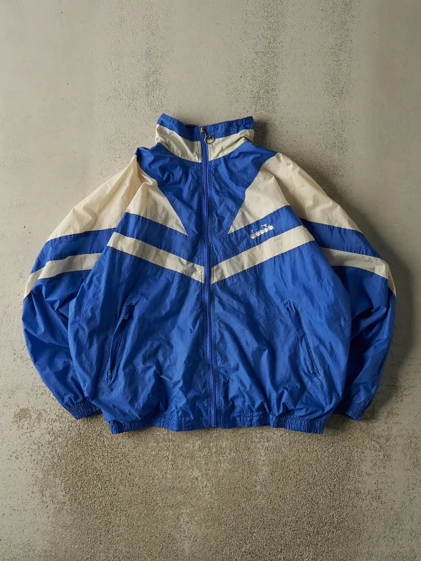 Vintage 90s Blue & White Diadora Embroidered Windbreaker Jacket (L/XL) made by Rebalance Vintage