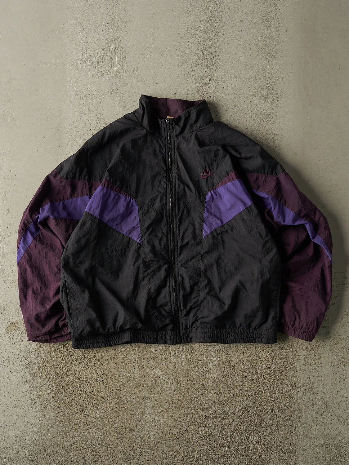 Vintage 90s Black & Purple Nike Embroidered Windbreaker Jacket (M/L) sold by Rebalance Vintage