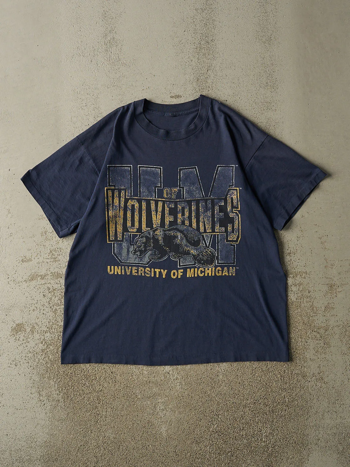 Vintage 90s Sun Faded Navy University of Michigan Wolverines Single Stitch Tee (L/XL) sold by Rebalance Vintage