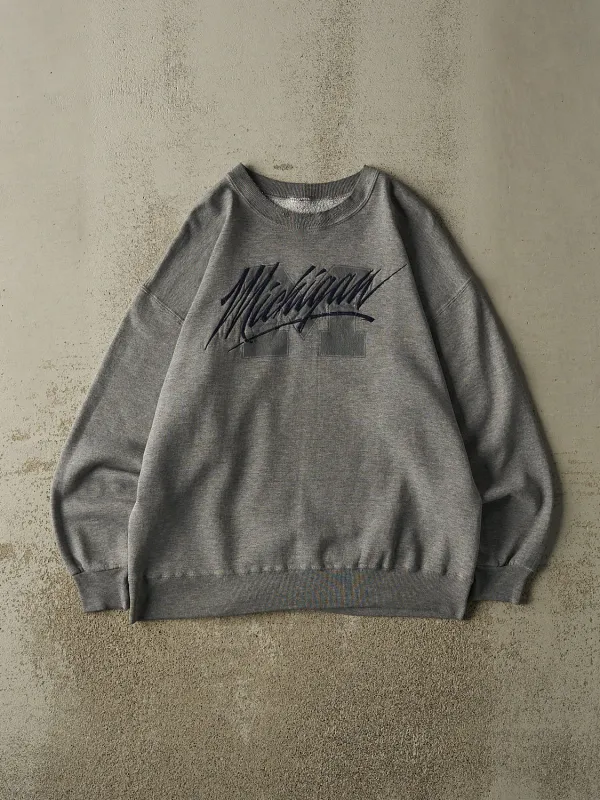 Vintage 90s Grey University of Michigan Crewneck (L) sold by Rebalance Vintage