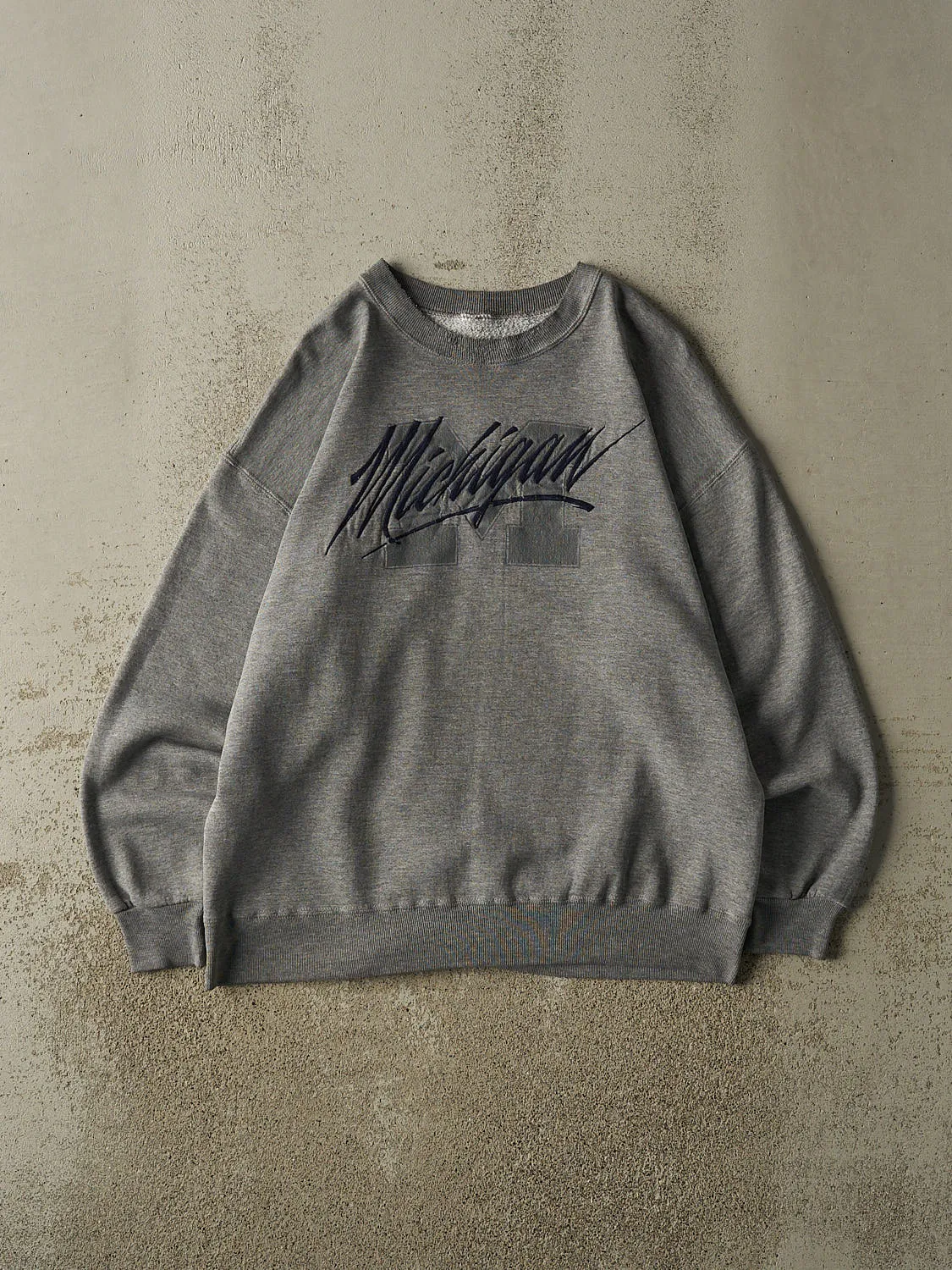 Vintage 90s Grey University of Michigan Crewneck (L) sold by Rebalance Vintage