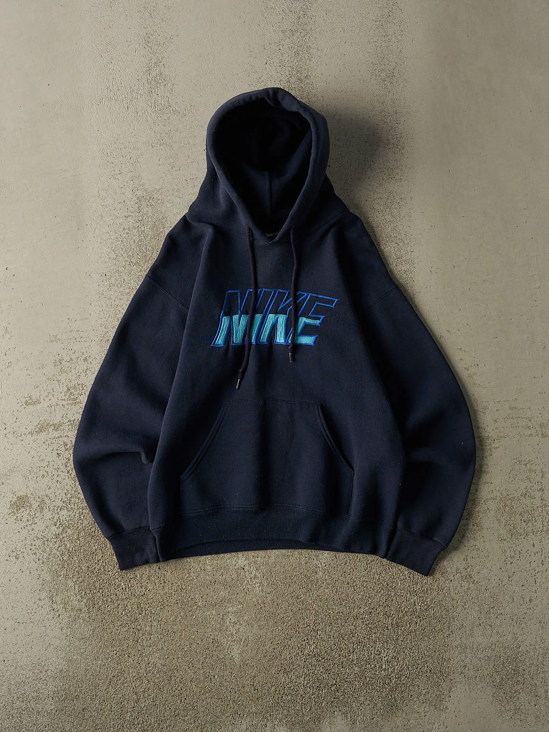 Vintage 90s Navy Blue Nike Embroidered Hoodie (S/M) sold by Rebalance Vintage
