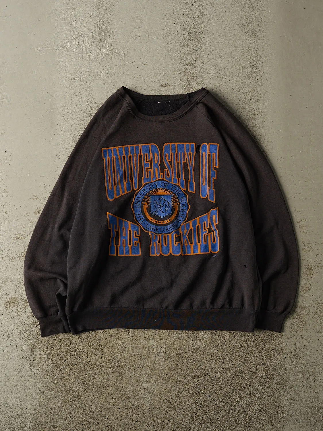 Vintage 80s Sun Faded Black University of the Rockies Crewneck (XL) sold by Rebalance Vintage