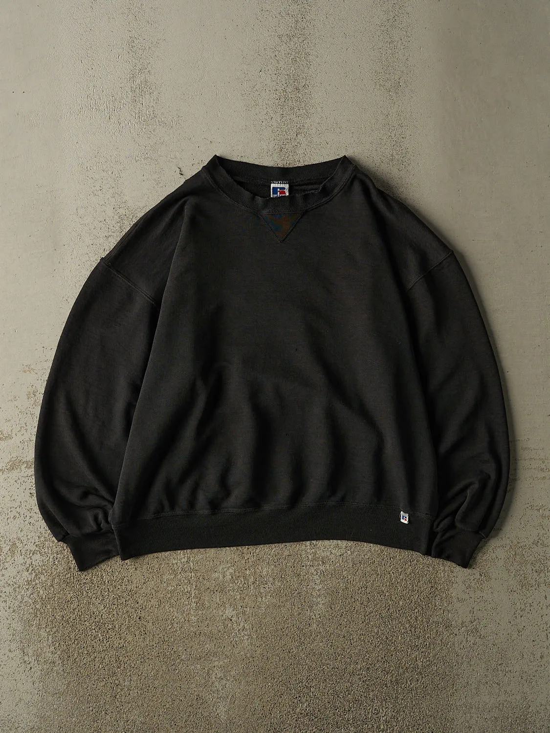 Vintage 90s Faded Black Russell Athletic Blank Crewneck (XL) sold by Rebalance Vintage